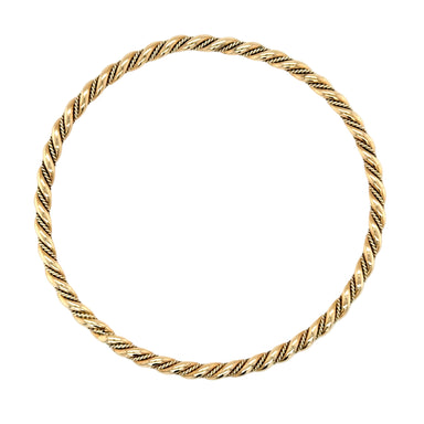 Gold bracelet with a twisted design on a white background